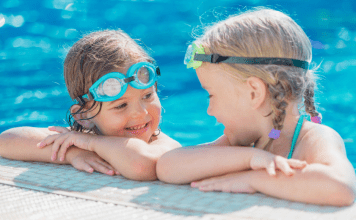 two girls playing in the pool