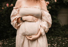 Pregnant woman posing in garden