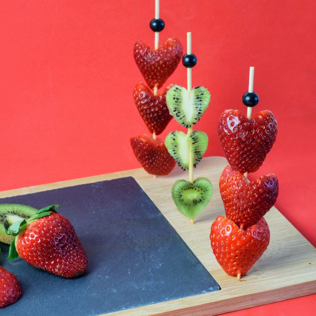 heart shaped strawberries and kiwi on skewers