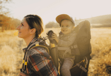 women hiking with a baby in a hiking carrier